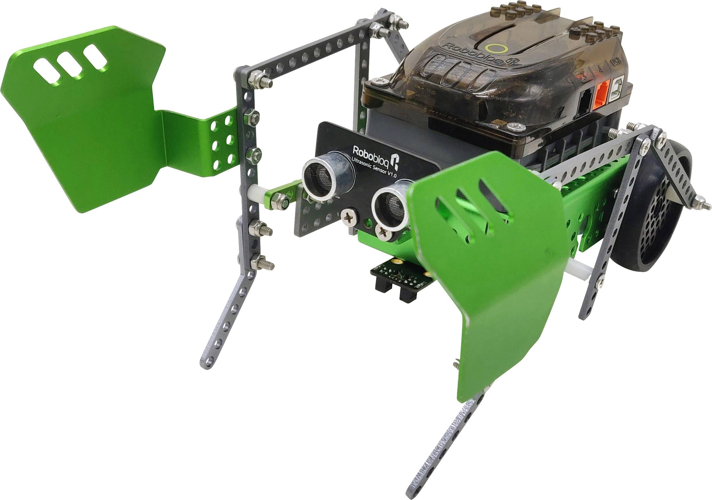 Un petit robot vert avec des capteurs et des parties mobiles, qui se tient sur une surface blanche.