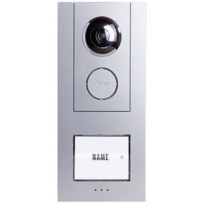 Interphone vidéo avec caméra et bouton d'appel. En dessous, un champ prévu pour le nom de l'occupant. Appareil en métal argenté.