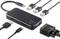'Hub USB-C avec ports HDMI, VGA, USB et câbles offrant diverses possibilités de connexion avec les appareils.'