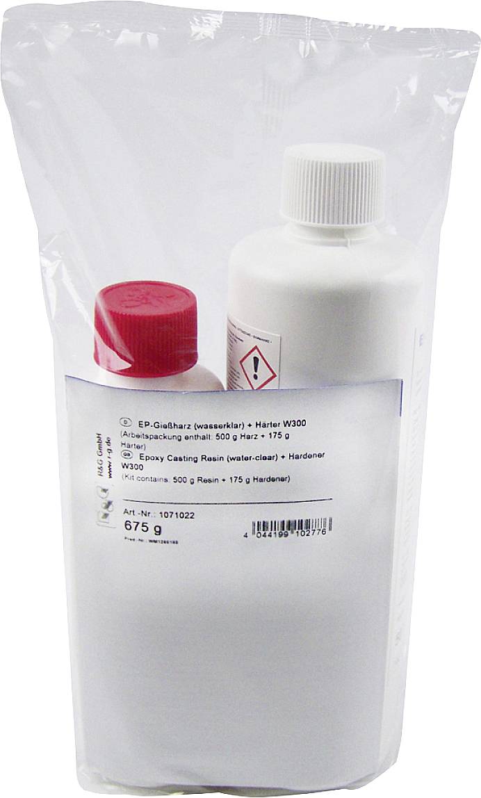 Deux bouteilles dans un emballage transparent ; bouchons rouge et blanc. Étiquette avec avertissements chimiques et informations sur le produit.
