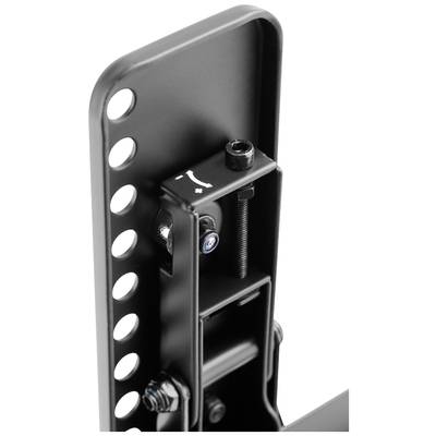 Gros plan sur un accessoire métallique noir comportant plusieurs vis et trous, probablement un élément d'un support ou d'un dispositif de fixation.