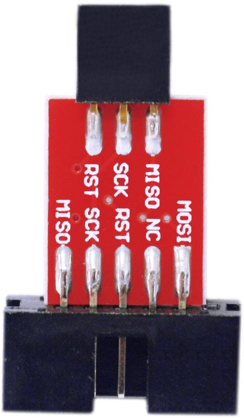 Sur l'image, on peut voir un adaptateur rouge et noir avec six broches argentées étiquetées 'MISO', 'SCK', 'RST' et 'MOSI'.