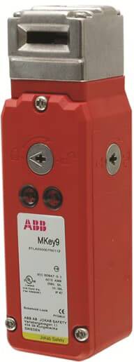 Un interrupteur de sécurité rouge de ABB portant l'inscription 'MKey9'. Il comporte deux vis et un insert métallique en haut.