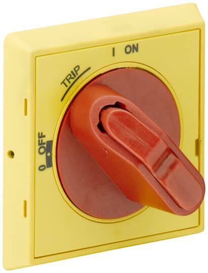 Un bouton d'arrêt d'urgence jaune avec un levier rouge est positionné sur 'ON'. Le bouton possède des marquages pour 'OFF' et 'TRIP'.