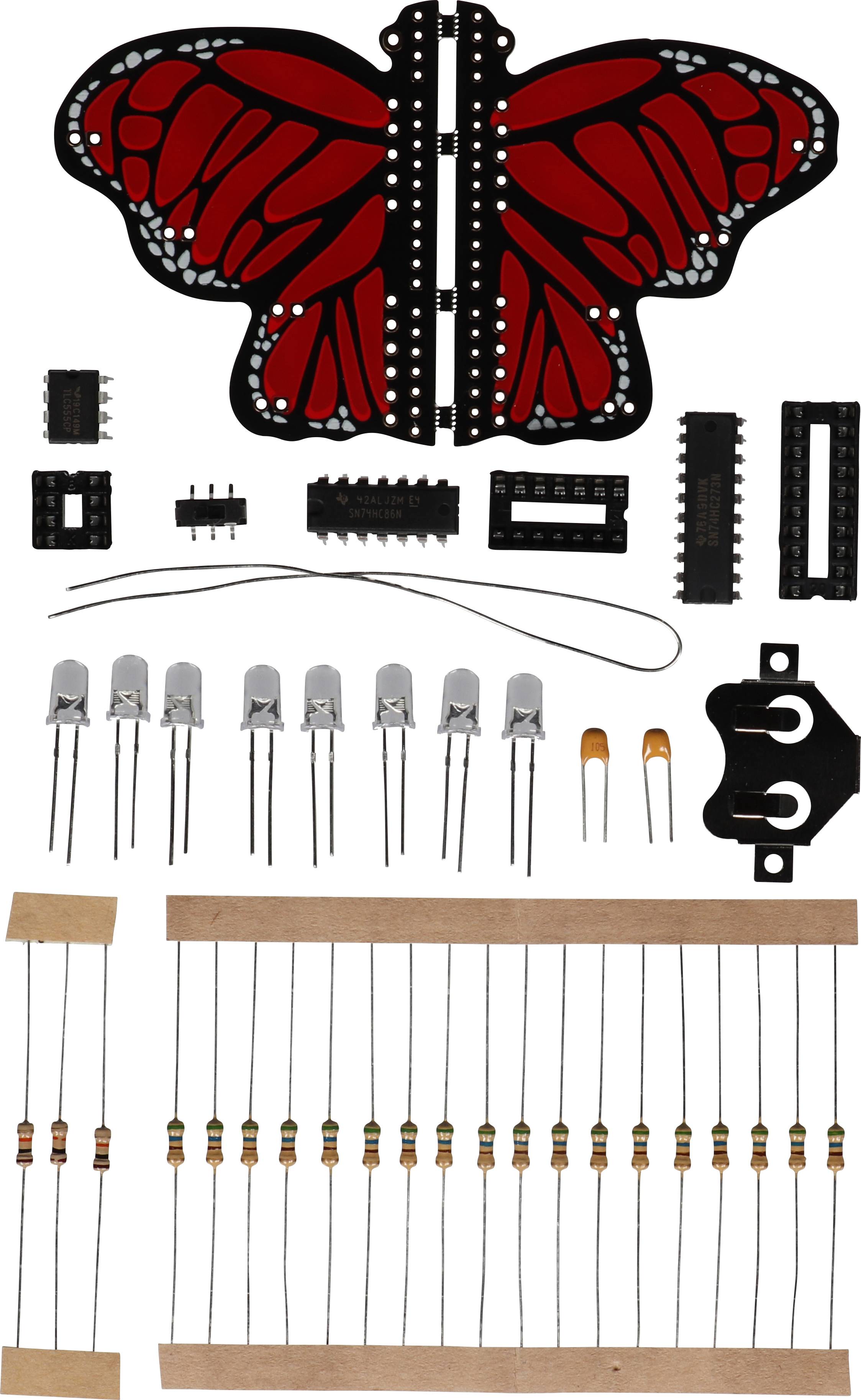 Un kit sous forme de papillon aux ailes rouges. Comprend des composants électroniques tels que des LED, des résistances et des connecteurs.