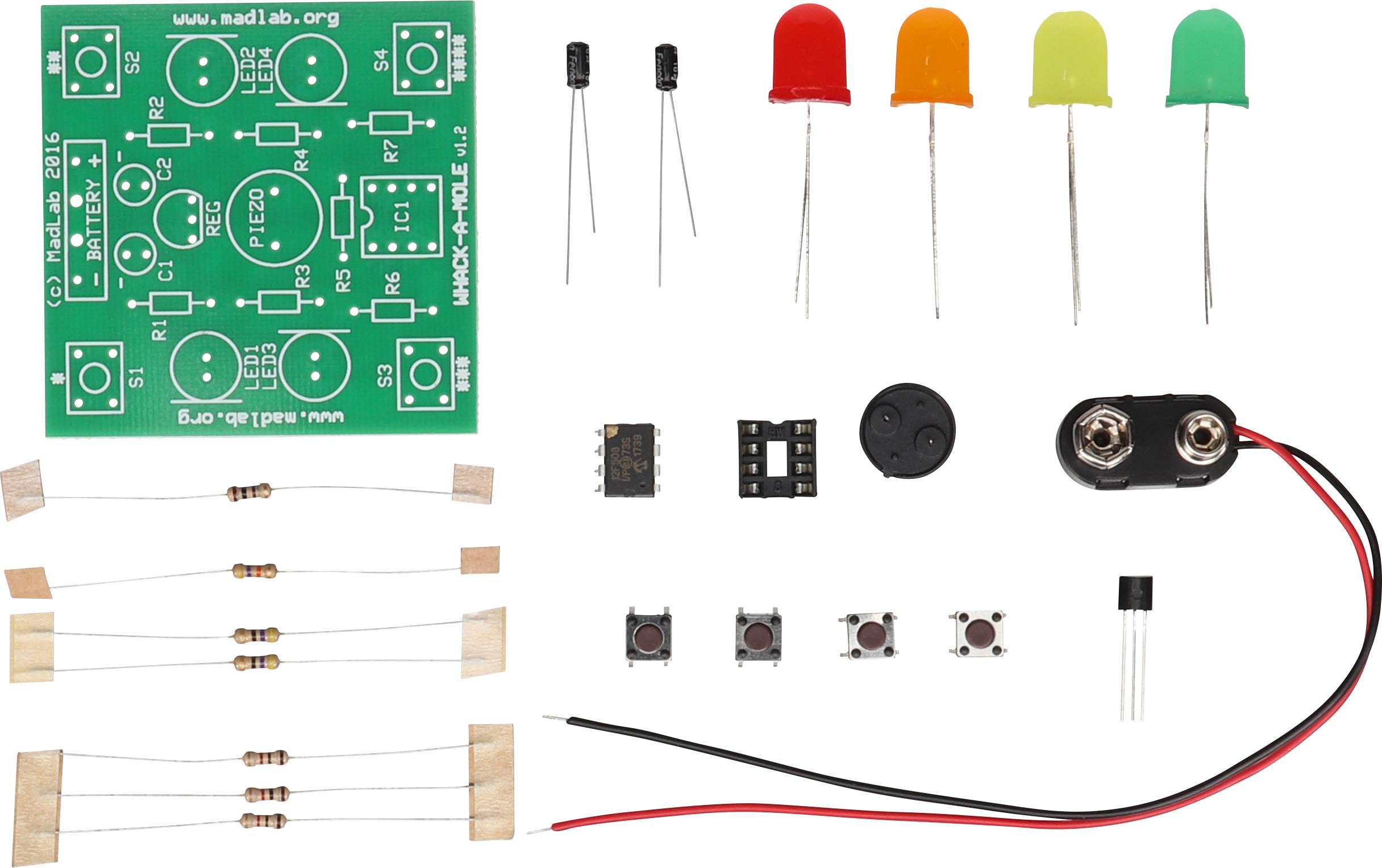 Un kit électronique comprenant un circuit imprimé, des LED, des résistances, des interrupteurs et des composants pour le montage de circuits électroniques.