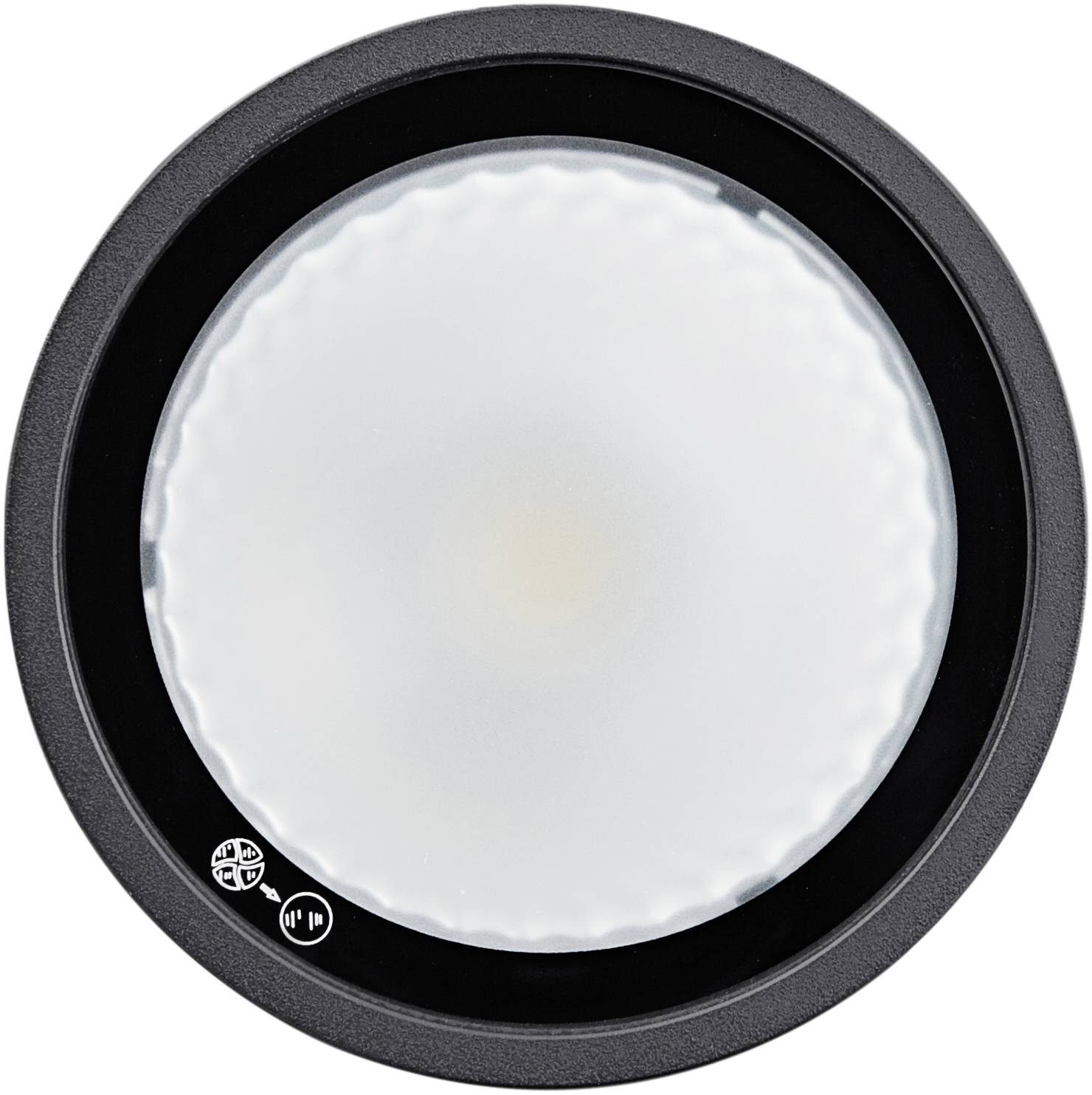 Objet rond, plat, blanc avec un bord noir, vu de dessus, probablement une lampe ou un luminaire.
