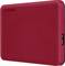 Disque dur externe Toshiba à surface structurée et connecteur USB sur le côté.