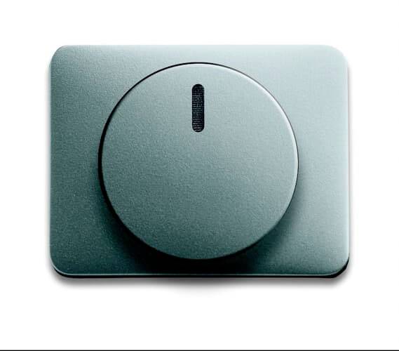 Interrupteur bleu, rectangulaire, avec un grand bouton rotatif rond au centre, disposé horizontalement.