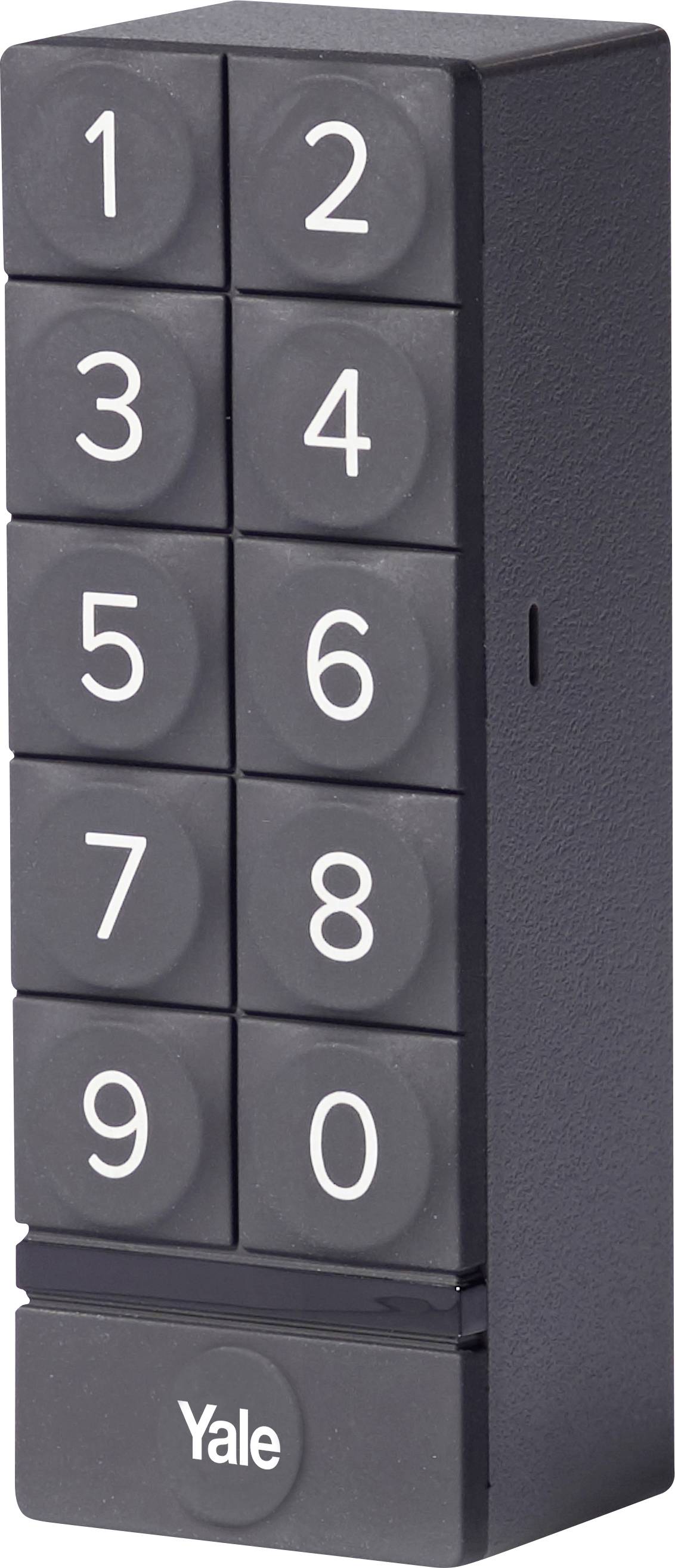 Pavé numérique noir et gris, disposition verticale : 1 à 9, avec 0 en dessous. Marquage « Yale » en bas. Vue verticale du côté gauche.