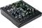 Console de mixage audio Mackie avec plusieurs potentiomètres, connexions et affichages, adaptée pour le mixage sonore et les enregistrements audio.