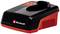 Un chargeur noir et rouge de la marque Einhell, adapté pour fonctionner avec des batteries compatibles.