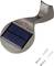 Lampe solaire avec boîtier gris foncé et panneau solaire sur le dessus. Contient un bouton rouge. Deux vis et chevilles sont posées à côté.
