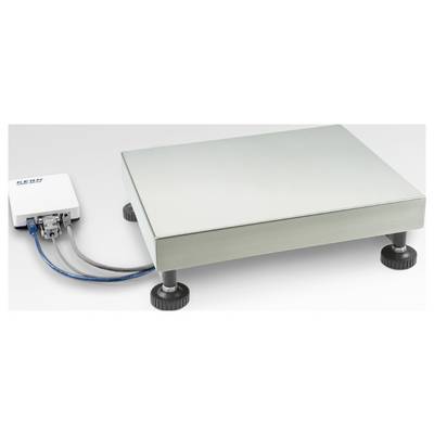 Une balance argentée avec une plateforme rectangulaire et quatre pieds réglables, reliée par câble à un boîtier de commande blanc externe.
