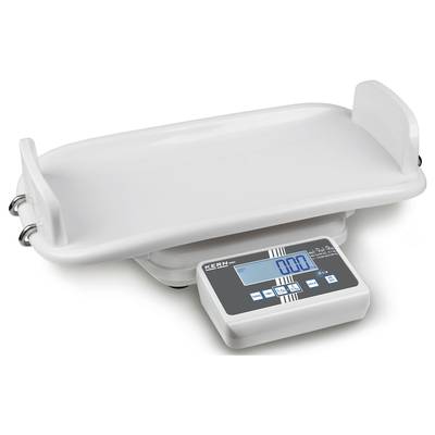 Balance numérique pour bébé avec surface de pesée en forme de coque et affichage digital en dessous, réglée à zéro.