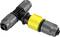 Raccord en T en plastique gris avec fixation jaune. Typiquement utilisé dans les systèmes d'irrigation.