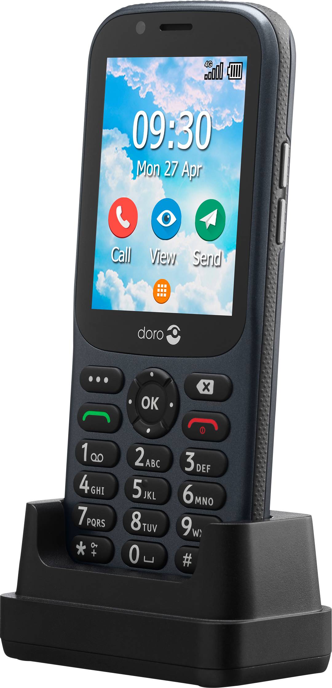 Un téléphone portable pour seniors sur une station de charge, doté de touches larges et d'un écran couleur affichant la date, l'heure et des icônes d'applications.