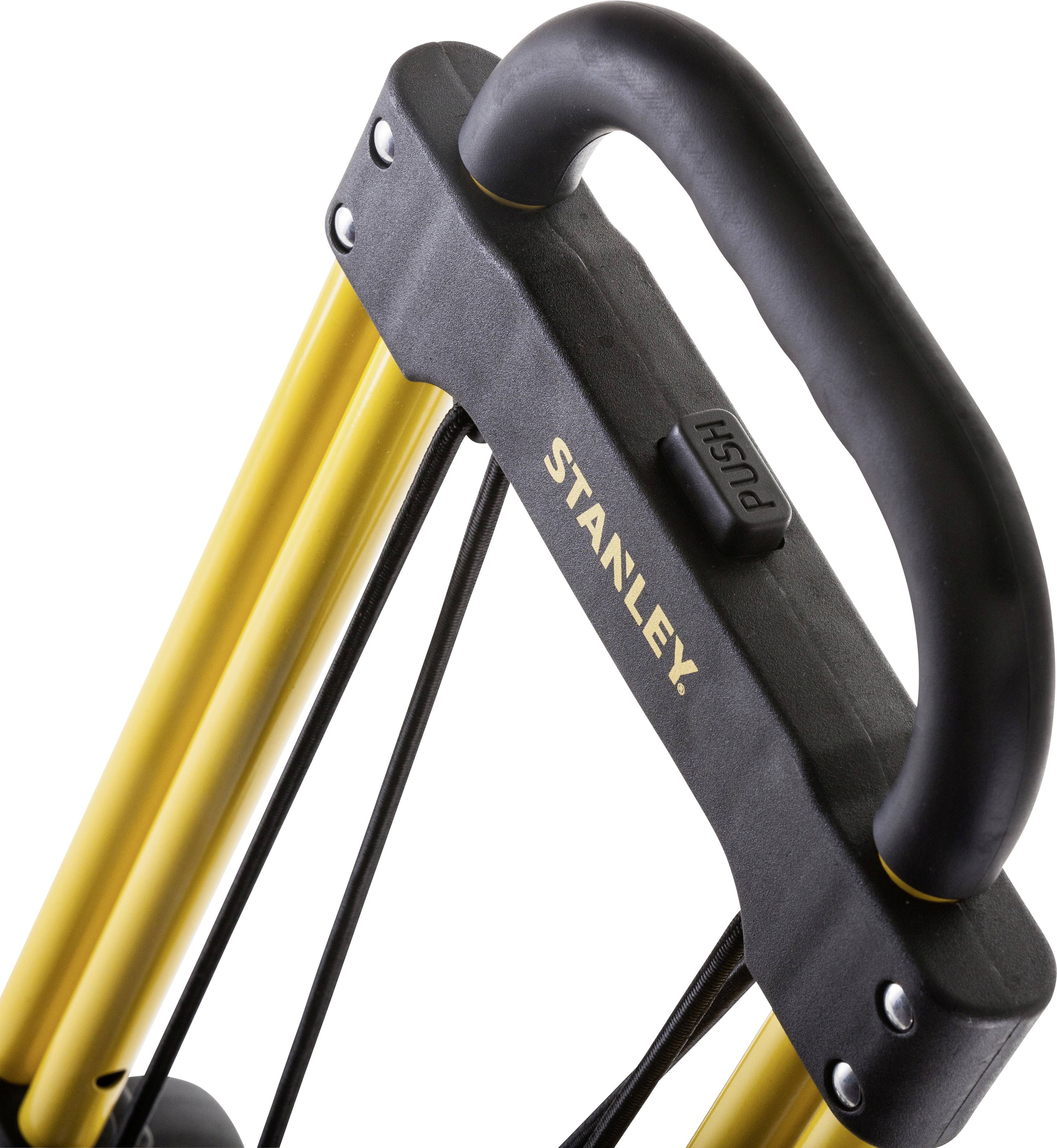 Chariot de transport de la marque Stanley, avec un châssis métallique jaune et une poignée noire sur laquelle est inscrit 'PUSH'.