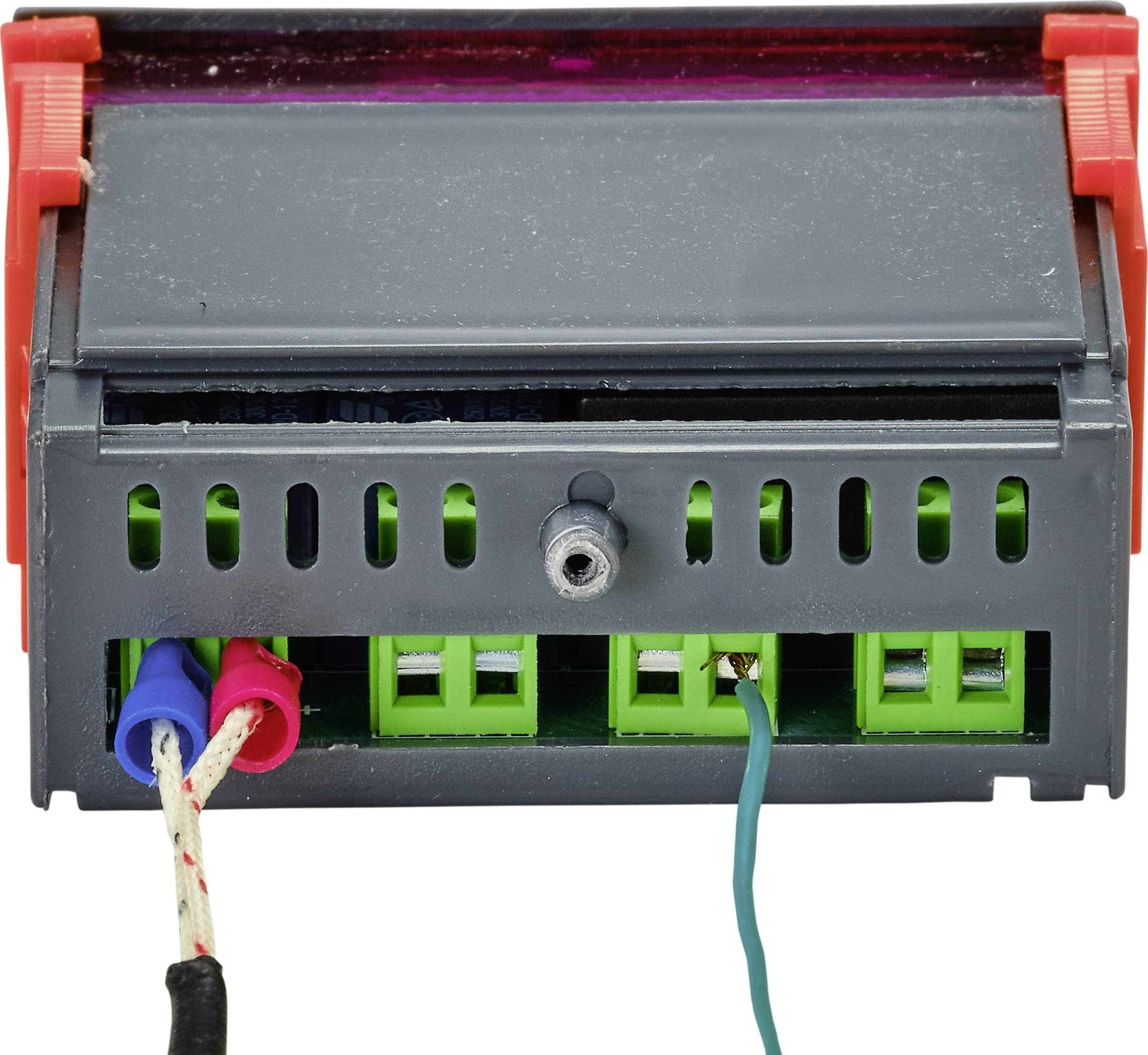 Dispositif électrique de commande avec quatre bornes de connexion et câbles de différentes couleurs. Destiné à la connexion et au contrôle électriques.