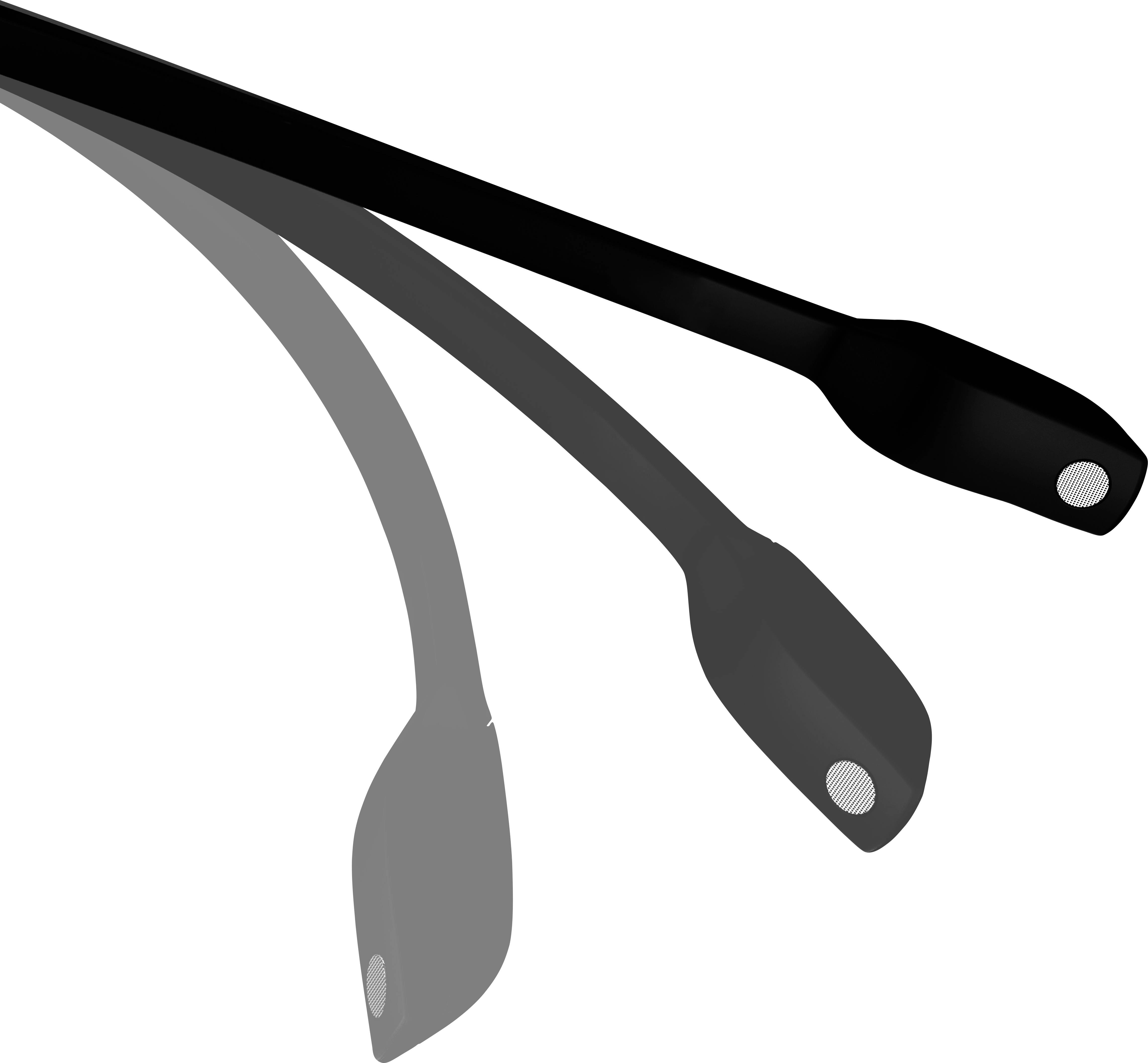 'Trois spatules en plastique noir disposées les unes sur les autres, présentant une légère courbure, avec des poignées ovales et des trous en leur centre.'