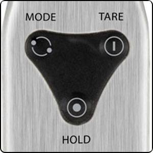 Surface de commande d'une balance numérique. Boutons pour 'Mode', 'Tare' et 'Hold'. Contexte : Utilisation et réglage de la balance.