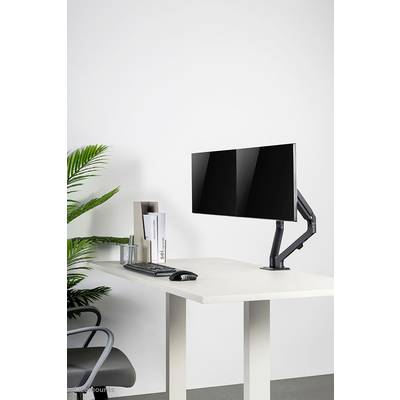 Bureau moderne avec bras de moniteur ergonomique, clavier, souris et décoration élégante ; aménagement de bureau minimaliste.