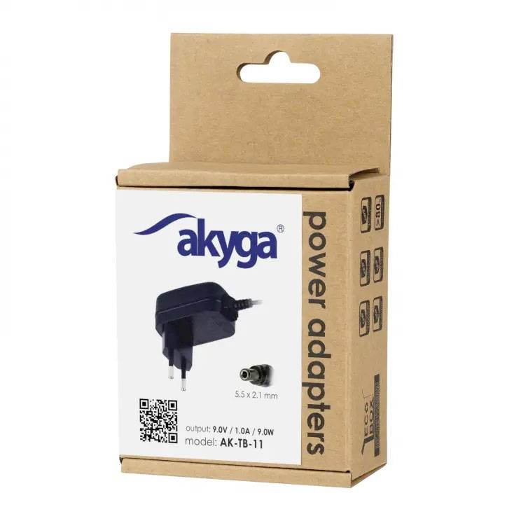 Boîte en carton d'un adaptateur secteur de la marque Akyga avec une sortie de 9V/10A. Contient une illustration de la fiche et le numéro de modèle AK-TB-11.