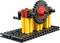 Modèle de transmission par engrenages mécanique en blocs de construction colorés, comprenant une manivelle manuelle. Présente des roues dentées en jaune, rouge et noir.