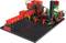 Robot de construction modulaire sur base noire avec des composants rouges et verts ; de nombreuses connexions de câbles sont visibles.