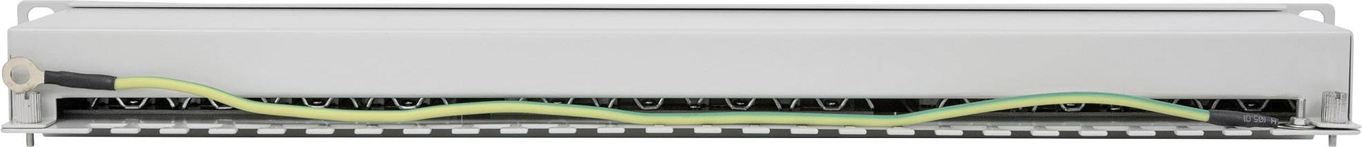 Composant électrotechnique métallique avec connexion de câble de terre jaune et vert.