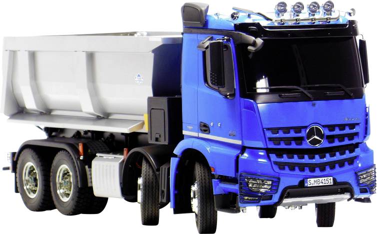 Un camion bleu avec le logo Mercedes est garé, montrant les vues avant et latérale. Il a de grandes roues et des feux supplémentaires en haut.