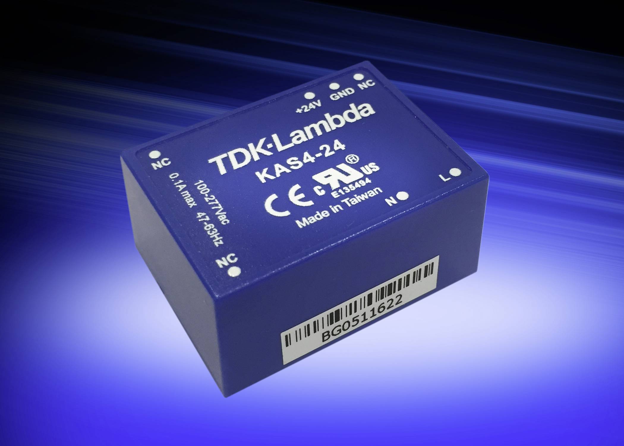Un convertisseur de tension bleu portant l'inscription 'TDK-Lambda KAS4-24', avec certification CE et UL, fabriqué à Taïwan, sur un fond bleu.