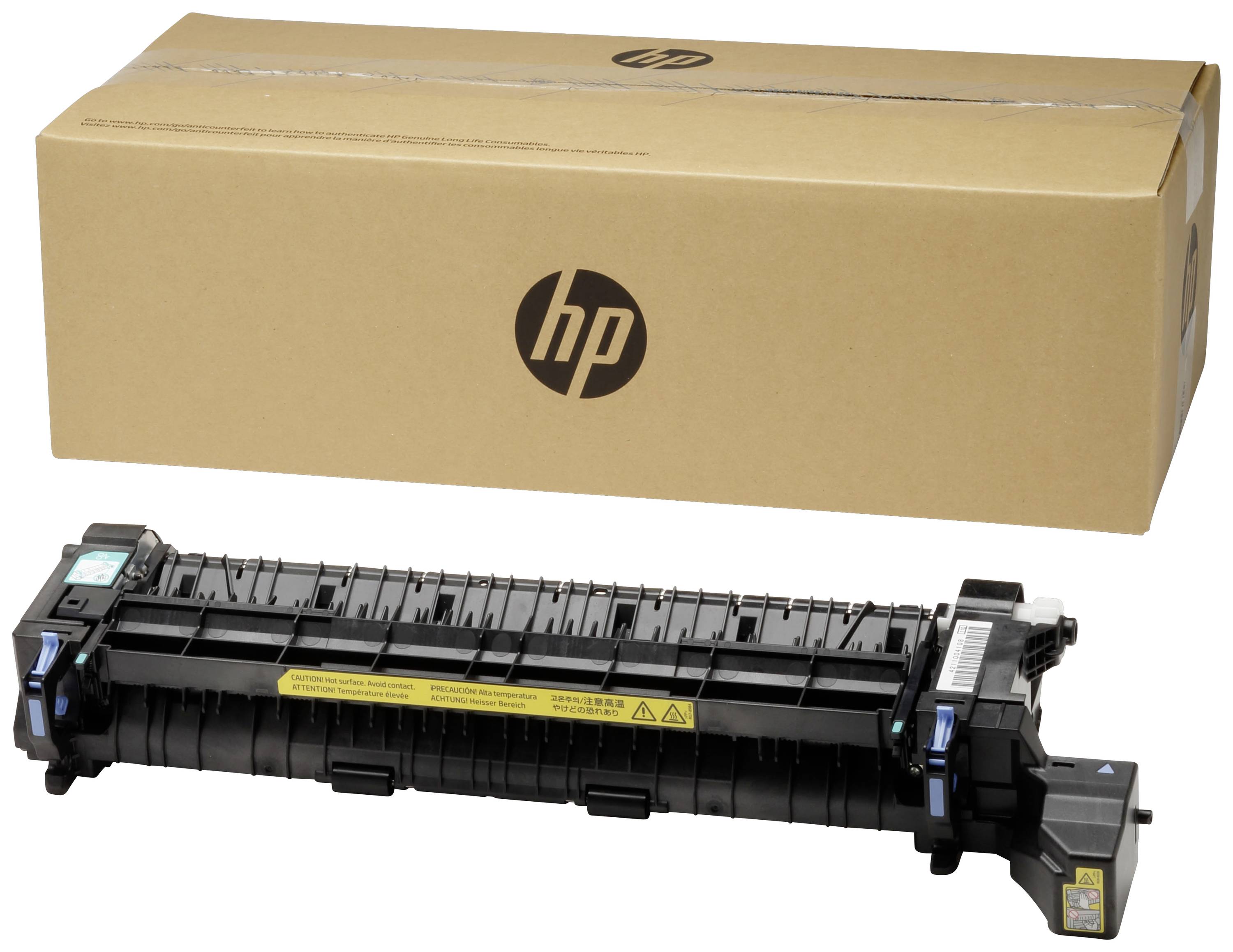 Une pièce de rechange pour imprimante est posée devant un emballage HP.