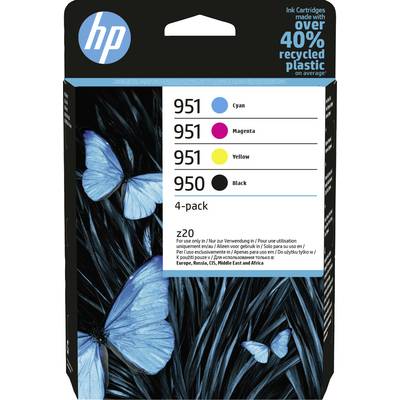 Des papillons bleus sont posés sur des feuilles bleu foncé. Emballage de cartouches d'imprimante dans les couleurs Cyan, Magenta, Jaune et Noir.