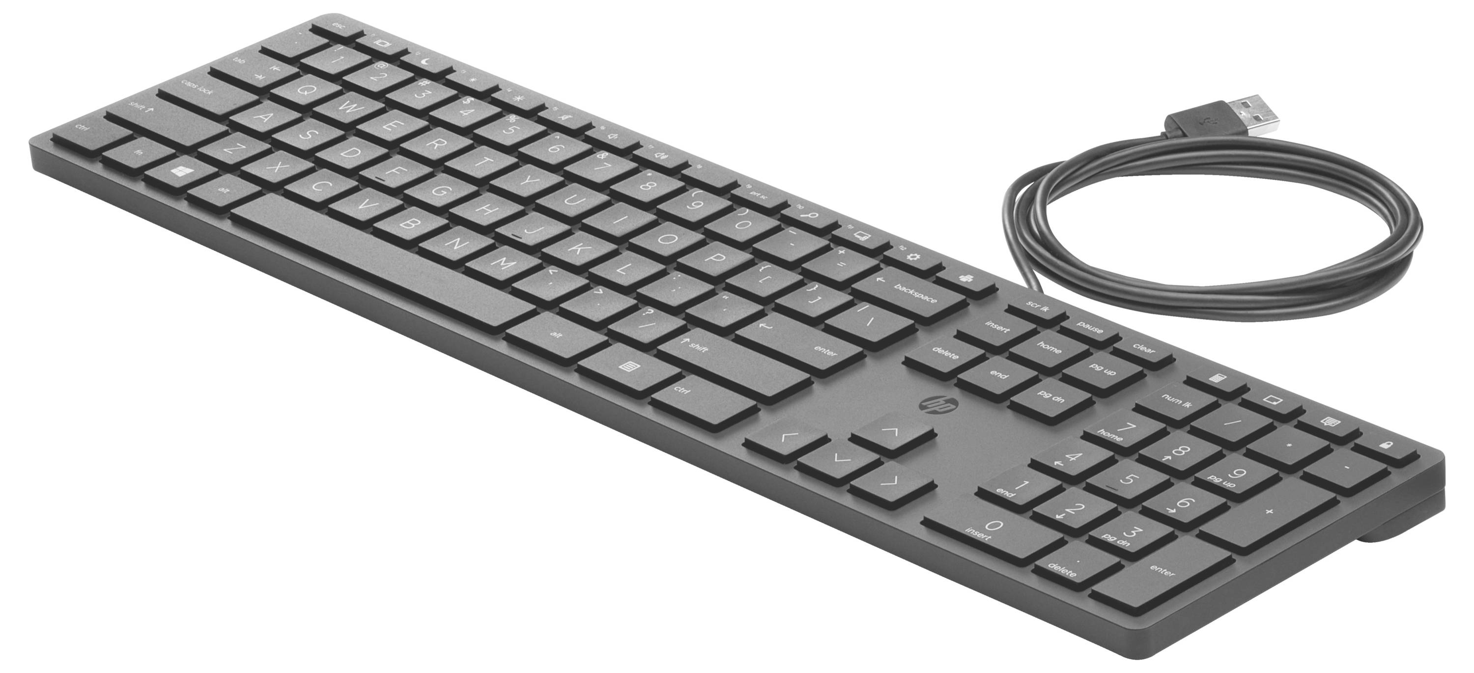 Un clavier USB noir avec pavé numérique, photographié de dessus. Le câble est branché et enroulé.
