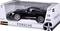 Voiture miniature noire Porsche dans un emballage portant l'inscription « Porsche » ; convient aux enfants à partir de 3 ans.