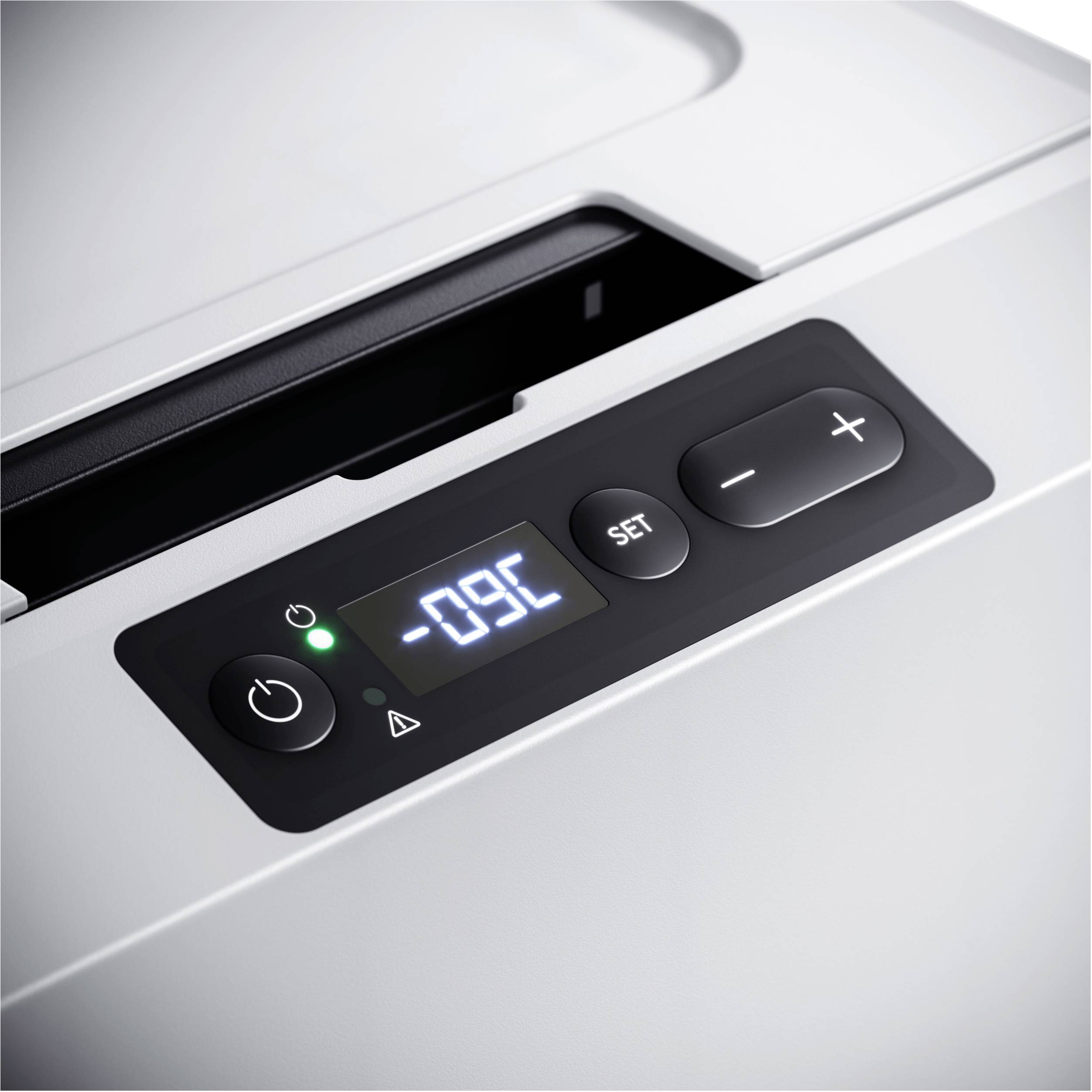 Un affichage numérique sur un appareil électroménager indique '-09°C'. À côté se trouvent des boutons de réglage.
