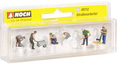 Un emballage contenant six petites figurines de travailleurs de voirie dans différentes poses de travail, à l'échelle TT.