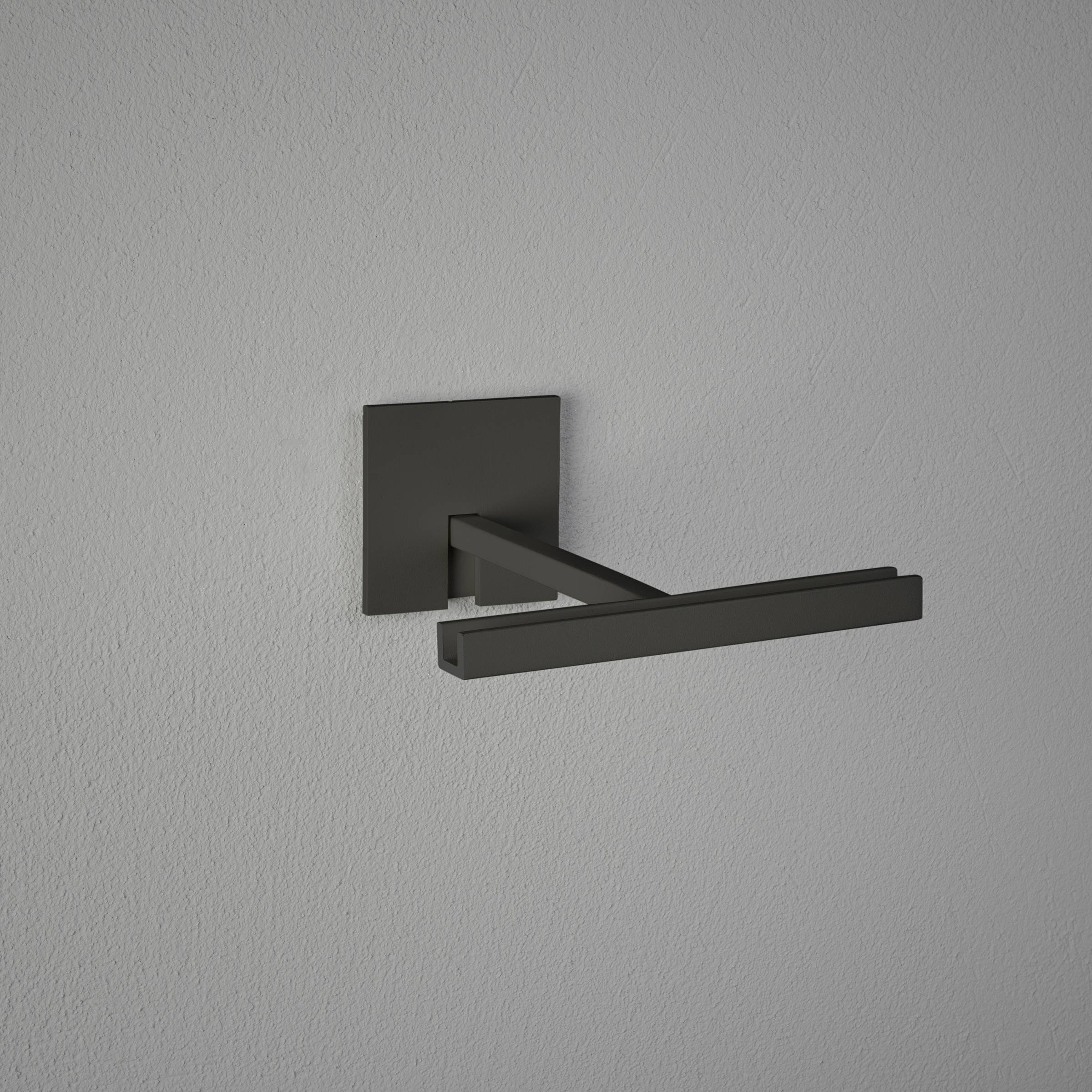 Un support mural moderne et minimaliste de couleur sombre, monté sur un mur peint en gris, adapté pour les serviettes.