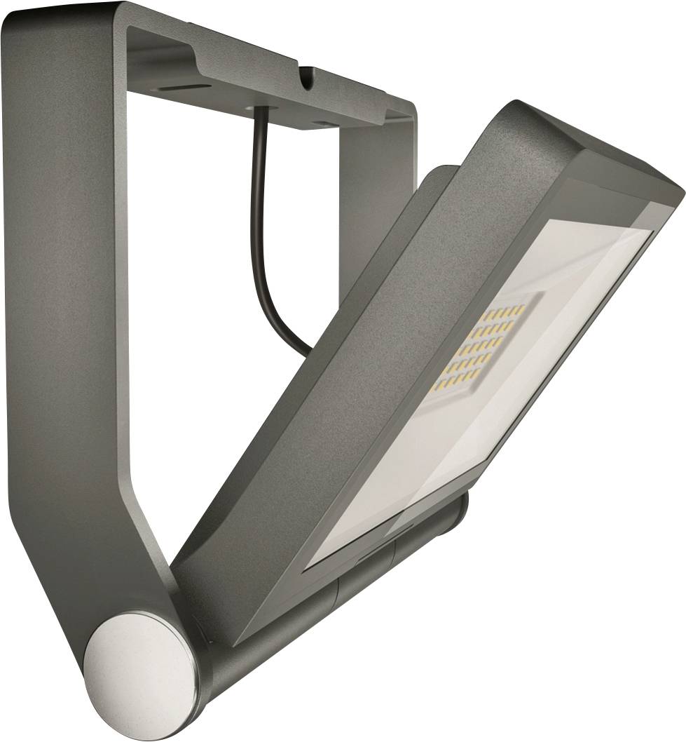 Un luminaire extérieur LED moderne en noir, avec une tête de lampe rectangulaire inclinée vers l'avant et un cadre robuste pour montage mural.