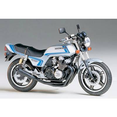 Une moto bleu et blanche portant l'inscription Honda, avec une selle noire et un échappement noir sur un fond gris.