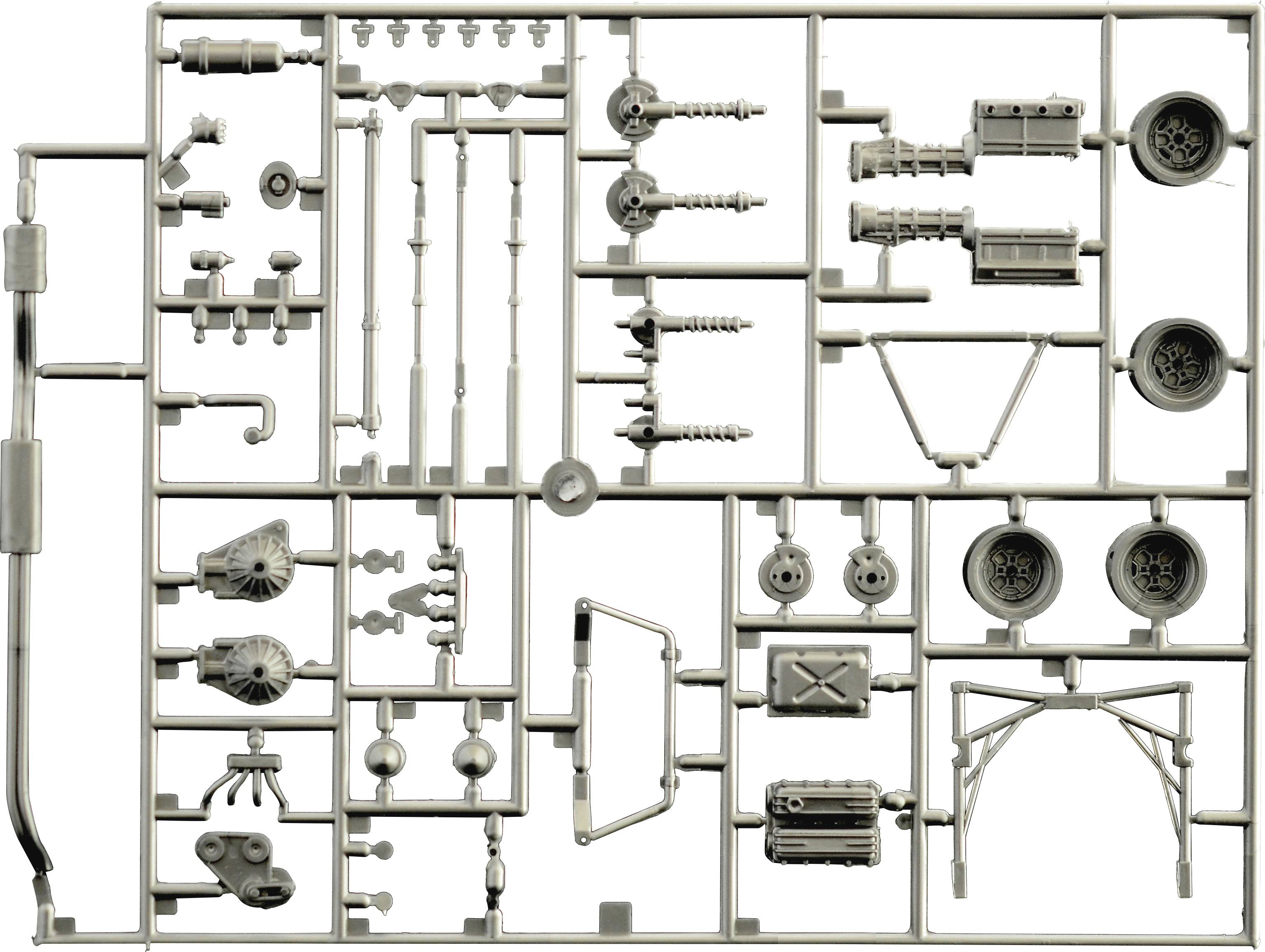 Pièces d'un kit de maquette en plastique. Différentes pièces automobiles, pneus et essieux, disposés méthodiquement dans un cadre. Prêts à être assemblés.