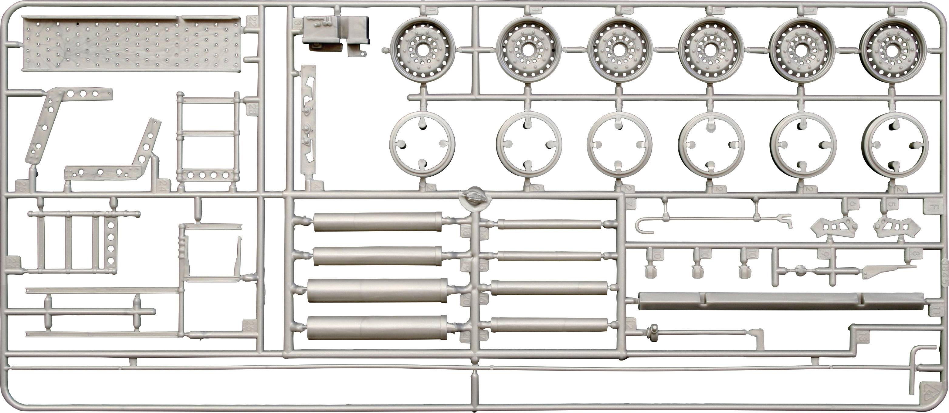 Kit de modèle en plastique comprenant différentes pièces : roues, cylindres et éléments structurels sur un cadre de moulage pour l'assemblage.