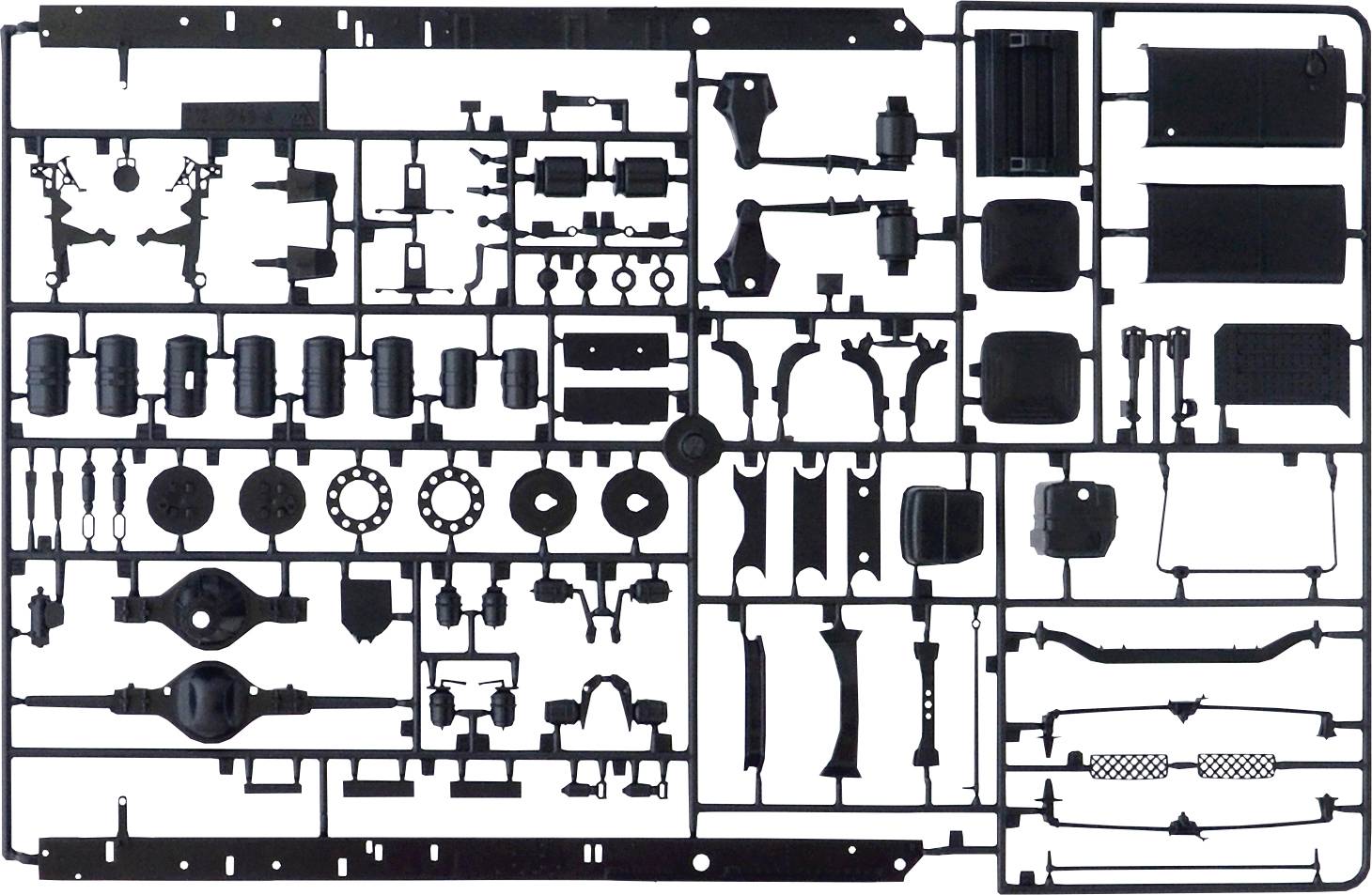 Kit de construction avec des pièces en plastique noir pour modélisme, différentes formes et tailles, disposées sur un cadre rectangulaire.
