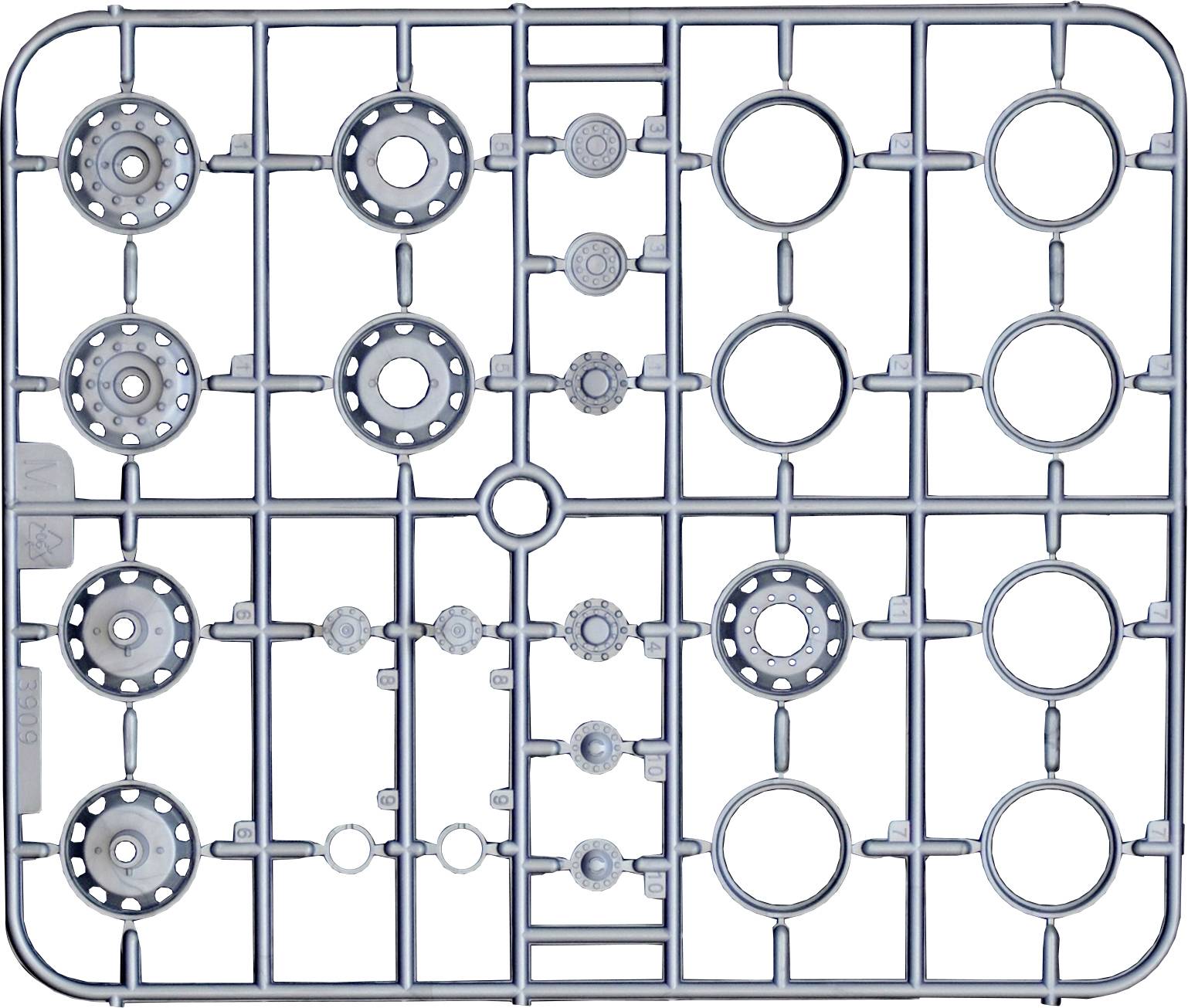 L'image montre un cadre de construction Lego gris avec des formes rondes et rectangulaires servant à la fixation des pièces.