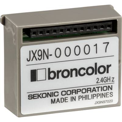 Un appareil électronique rectangulaire portant l'inscription « broncolor 2,4 GHz » et « SEKONIC CORPORATION MADE IN PHILIPPINES ».