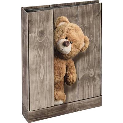 Un ours en peluche dépasse d'une caisse en bois, comme s'il jouait à cache-cache. L'arrière-plan présente un grain de bois.