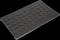 'Plaque rectangulaire noire en plastique avec de nombreux trous ronds, utilisable comme élément de structure ou de fixation.'