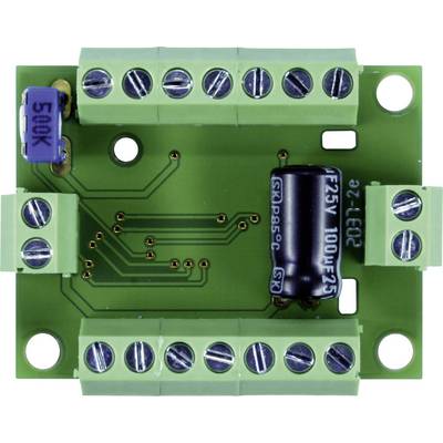 Circuit imprimé vert avec plusieurs bornes à vis argentées, une résistance variable bleue et un condensateur électrolytique noir.