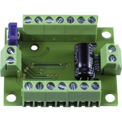 Circuit imprimé vert avec plusieurs bornes à vis et un condensateur cylindrique noir.